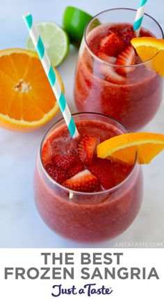 two glasses with strawberries, oranges and lime on the side next to each other