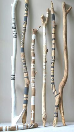 several pieces of art made out of wood sticks