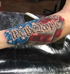 a man's arm with an american flag and the words happy birthday on it