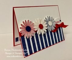 a close up of a greeting card with flowers on the front and back side,