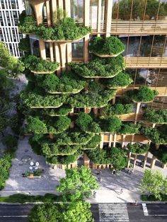 an aerial view of a building with trees growing on it