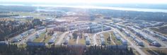 an aerial view of a train yard and trees