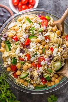 a glass bowl filled with rice and vegetables