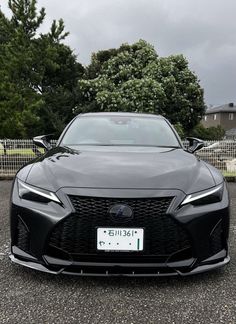 the front end of a black sports car