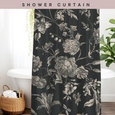 a black and white shower curtain with flowers on it in front of a bathtub