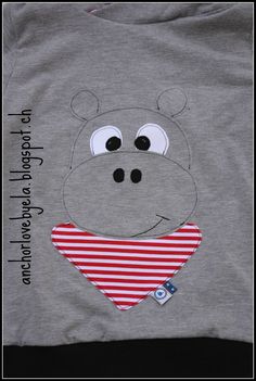 a gray shirt with a hippo face on it