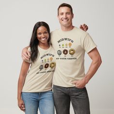 two people standing next to each other wearing t - shirts with donuts on them