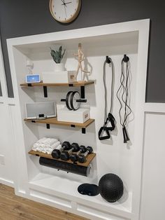 the shelves are organized and ready to be used for sports equipment, such as boxing gloves