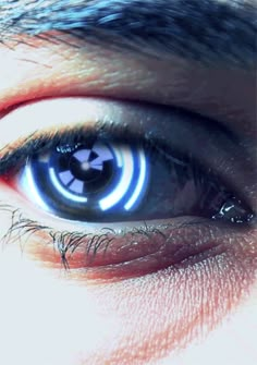 an eye with blue and white lights on it's iris is seen in this image