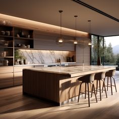 a modern kitchen with marble counter tops and bar stools next to an open window