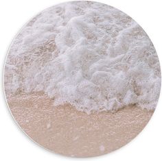 the water is white and foamy on the sandy beach side, as if it were an ocean wave