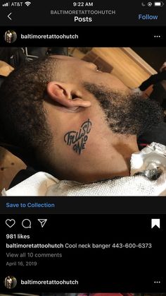 an image of a man with tattoos on his face and chest lying down in a barbershop