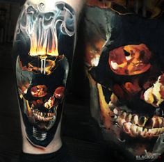 a man's leg with a tattoo on it and a skull in the background