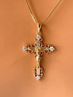 This is a 18kt gold-filled ornate crucifix cross pendant necklace.  Shown on a shiny 18kt gold filled box chain that measures 18" length.  his beautiful crucifix measures 35x20mm with bale. Please not that 18k gold filled is deeper in gold color, almost a pinkish gold.  Ships in a cute gift box ready to present. Gold filled jewelry is an actual layer of gold pressure bonded to another metal. Gold filled is not to be confused with gold plating as filled has 100% more gold than gold plating. Gold Cross Pendant Necklace Woman, Cross Charm Necklace, Rosa Gold, Crucifix Necklace, Jesus Cross, Catholic Jewelry, Jewelry Accessories Ideas, Dope Jewelry, Gold Cross Pendant