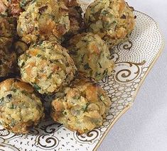 a plate full of muffins on top of a doily