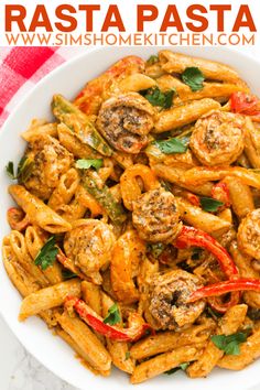 pasta with shrimp and peppers in a white bowl