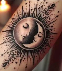 a woman's arm with a sun and moon tattoo on it