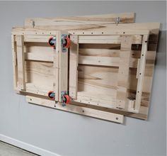 two pieces of wood are attached to the wall