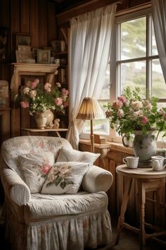 a living room filled with lots of furniture and flowers in vases on the windowsill