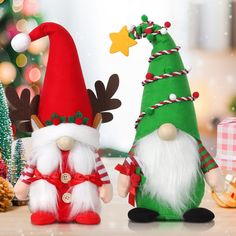 two christmas gnomes sitting next to each other