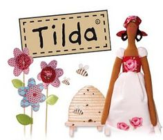 there is a doll next to flowers and a beehive with a sign that says tida