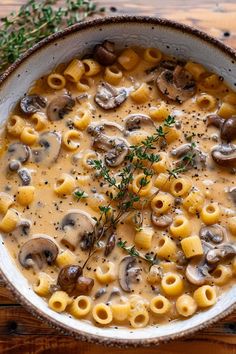 a white bowl filled with pasta and mushrooms