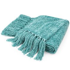 a teal colored blanket with fringes on the bottom and one end folded up