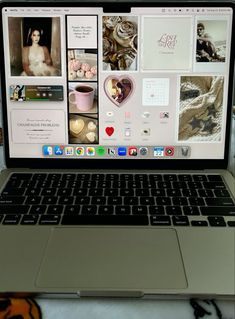 an open laptop computer sitting on top of a desk next to a cup of coffee