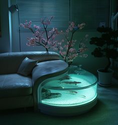 a living room filled with furniture and flowers on top of a glass table covered in water