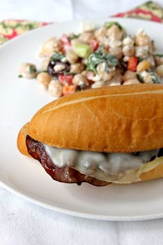 a sandwich and salad on a white plate