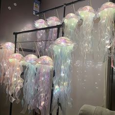 some jellyfish are hanging from the ceiling