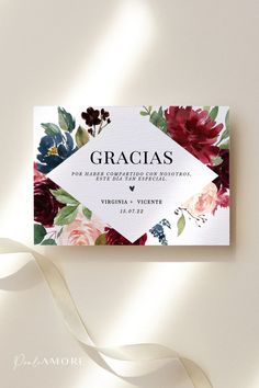 an elegant floral wedding card with the name gracias written in black on it