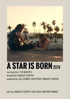 a man and woman sitting on the ground next to each other with text that reads, a star is born 2018