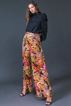 print high waist pants Brand: Flying Tomato Style: IP8106 Fabric: 100% POLYESTER Details: A printed woven pant featuring front pleats, side zipper closure and wide leg. **Matching jacket IJ10223** Self : 100% Polyester Size & Fit - Model is 5'8" And Wearing Size Small - Measurements Taken From Size Small - Approx. Length: 44" Chic Floral Print Ankle-length Wide Leg Pants, Casual Wide Leg Pants With Bold Print, Chic Wide-leg Pants With Floral Print, Chic Wide-leg Floral Print Pants, Chic Floral Print Wide-leg Pants, Chic Wide Leg Pants With Floral Print, Chic Wide Leg Floral Print Trousers, Trendy Straight Pants With Floral Print, Chic Floral Print Wide Leg Trousers