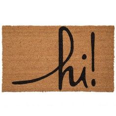 a door mat with the word phi written in cursive black ink on it