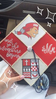 someone is holding up a decorated graduation cap