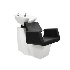 a white sink sitting next to a black chair