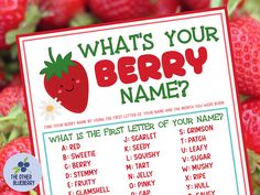 a sign that says what's your berry name? with strawberries in the background