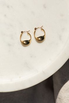 Add some twist to your style with our Irregular Twist Hoop earrings! These cute hoops make a statement with their unique design. Stand out from the crowd and add a playful touch to your outfit.(All good things come in twos, so you'll get a pair of these hoops!) Details: Stainless Steel, 18K Gold, waterproof + tarnish resistant, hypoallergenic Twist Hoop Earrings, Design Stand, Book Candle, European Vintage, Gold Hoops, Unique Design, Jewelry Accessories, 18k Gold, Unique Designs