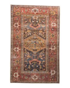 an antique persian rug with multicolored floral design