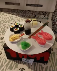 sushi on a table with chopsticks and rice