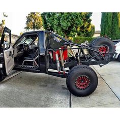 an off - road vehicle is parked on the sidewalk