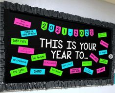 this is your year to bulletin board with post it notes and magnets on it