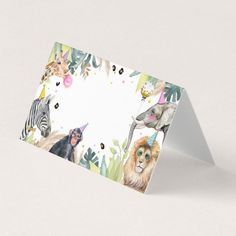 a card with animals and plants on it