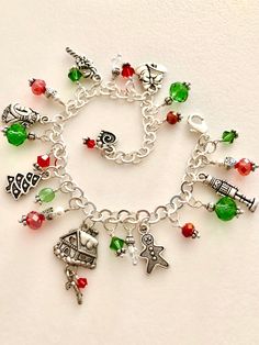 CHOOSE YOUR OWN CHARMS! "Family Traditions" Christmas charm bracelet where all the adorable charms are selected by you to tell your family's Christmas story. It is filled with lovely detailed antique silver and pewter charms and sparkling red and green Swarovski and Chinese crystals on shiny silver plated cable chain with lobster claw clasp.  The  photos are only examples of some of my family's favorite Christmas activities.  Darling charm bracelet features 6 to 12 detailed Tierra Cast two-sided (most charms) antique fine silver plated or silver pewter charms surrounded by red, green, and clear Swarovski AB crystals, Chinese Thunder Polish crystals, and Czech Fire Polish glass beads. All bead units are wire wrapped in plated silver with additional antique silver accents and crystals.  The Christmas Charm Bracelet, Christmas Bracelet, Custom Charms, Charms Bracelet, Christmas Story, Christmas Charms, Christmas Activities, A Christmas Story, Family Traditions