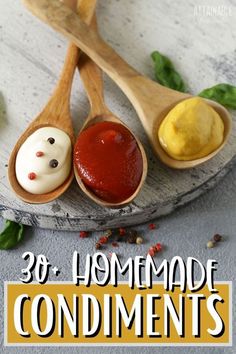 wooden spoons filled with homemade condiments on top of a table