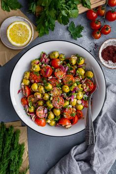 a white bowl filled with tomatoes and onions