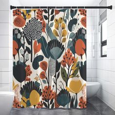 a bathroom with a shower curtain decorated with colorful flowers and leaves on white tile flooring