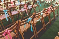 rows of wooden chairs with ribbons tied to them