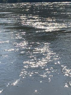 the sun shines brightly on the water as it reflects off the surface of the water